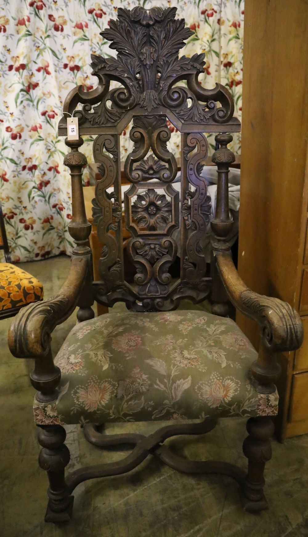 A late 19th century Flemish carved oak elbow chair, width 88cm height 150cm